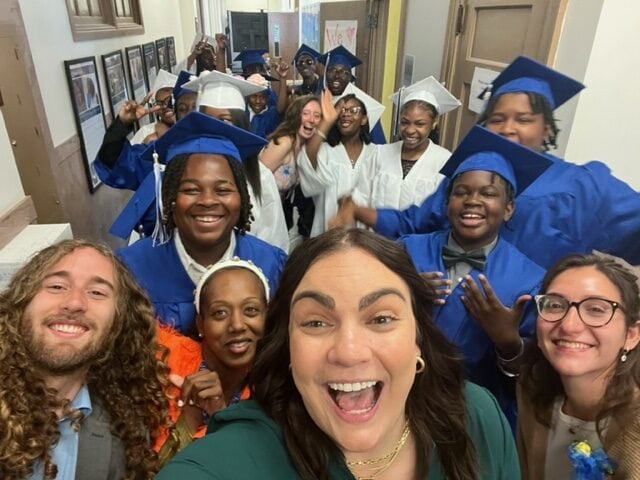 Graduating 8th graders at St. Malachy Catholic School celebrate with their teachers